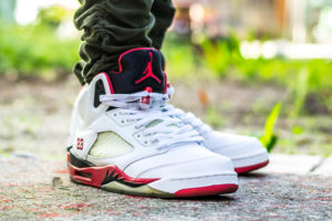 fire red 5s silver tongue on feet